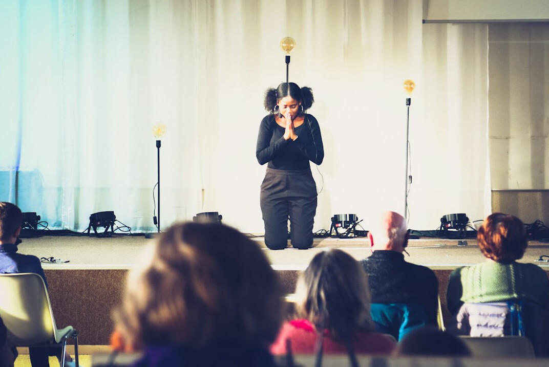 woman presenting to audience